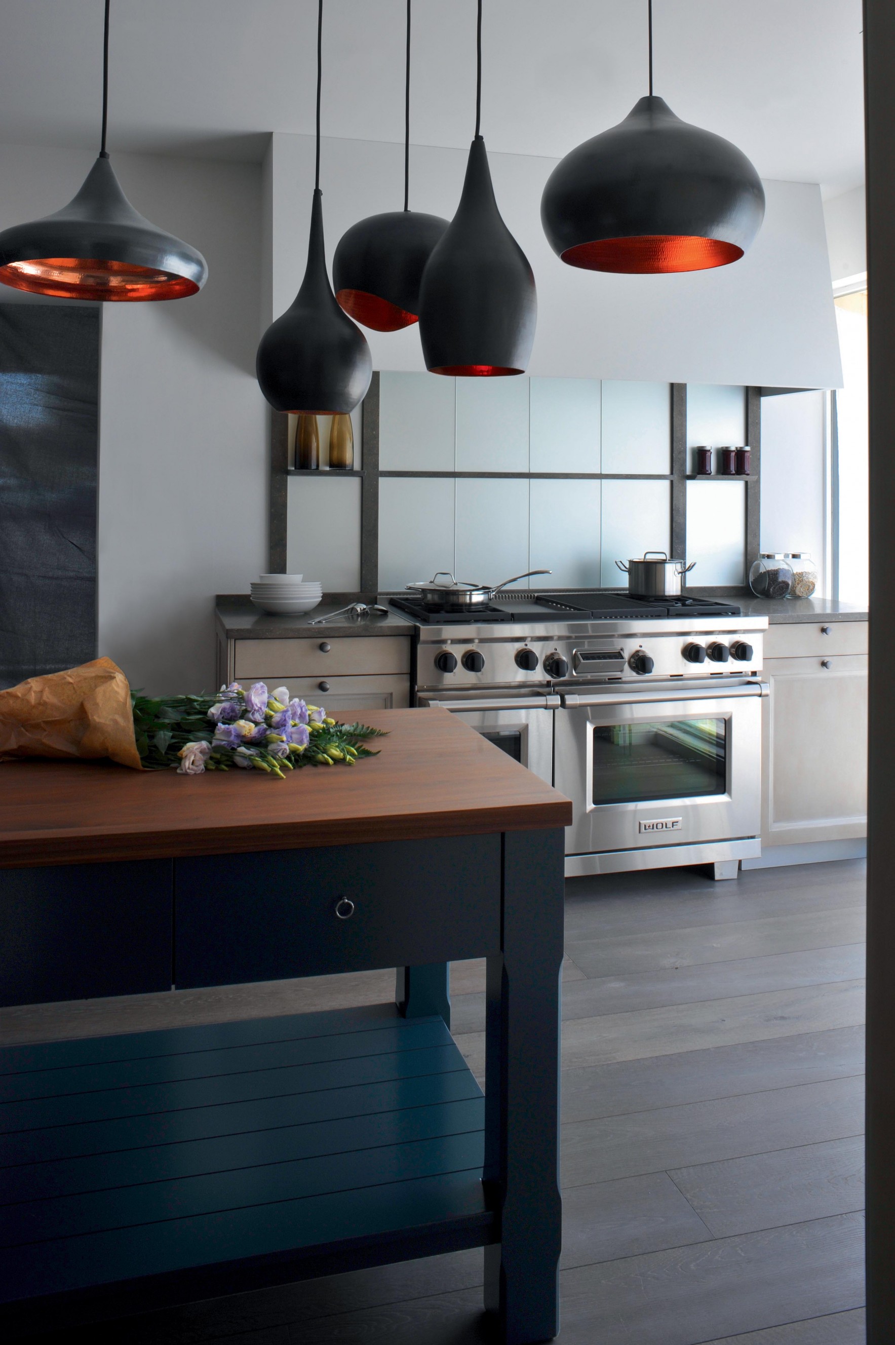 A charming kitchen featuring a top-of-the-line Wolf kitchen range