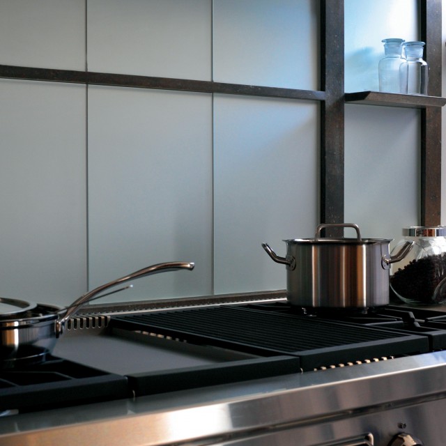 A charming kitchen featuring a top-of-the-line Wolf kitchen range - 3