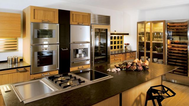 A highly functional kitchen island pairing oak and stainless steel