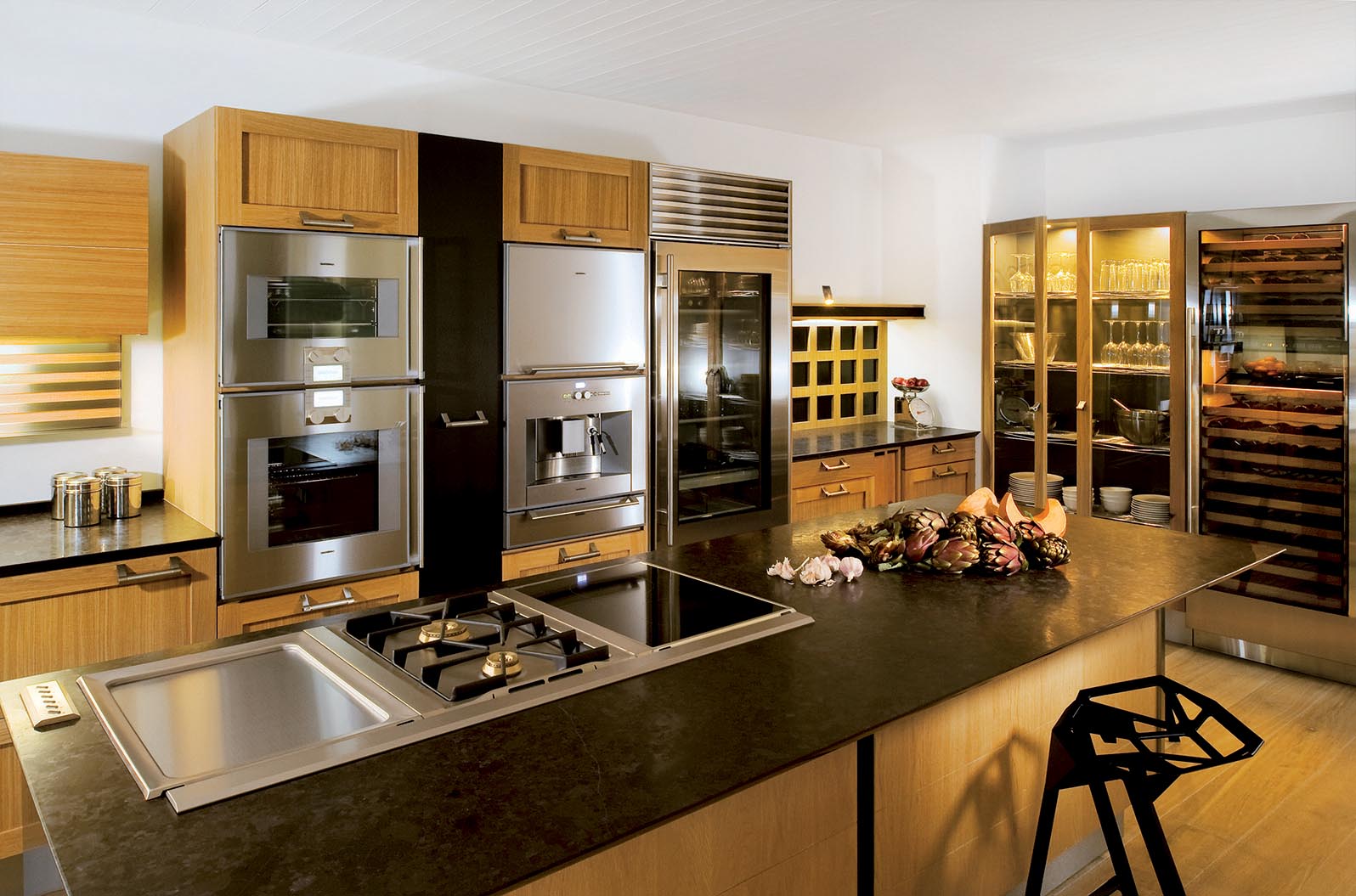 A highly functional kitchen island pairing oak and stainless steel