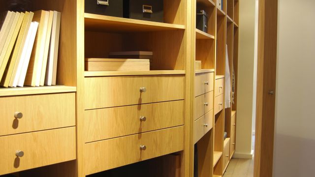 A custom closet pairing wood and leather