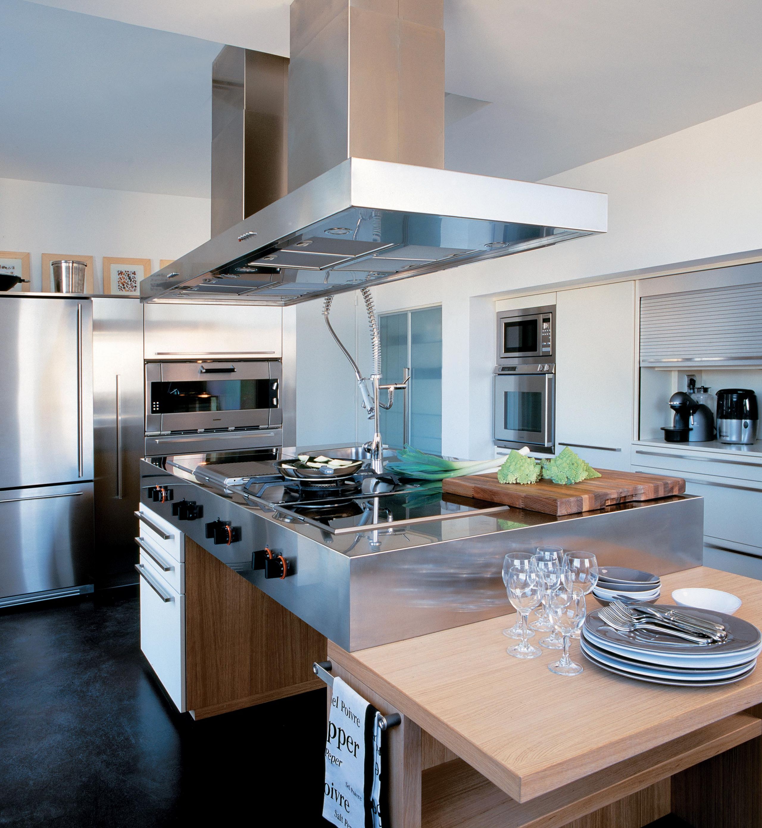 A majestic central island forming the heart of this unique kitchen