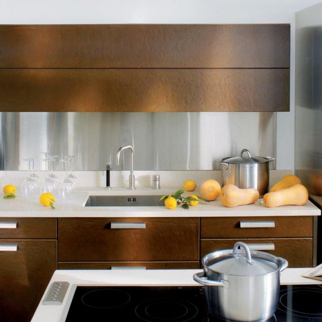 A bold kitchen with cool metallic elements and robust textures - 1