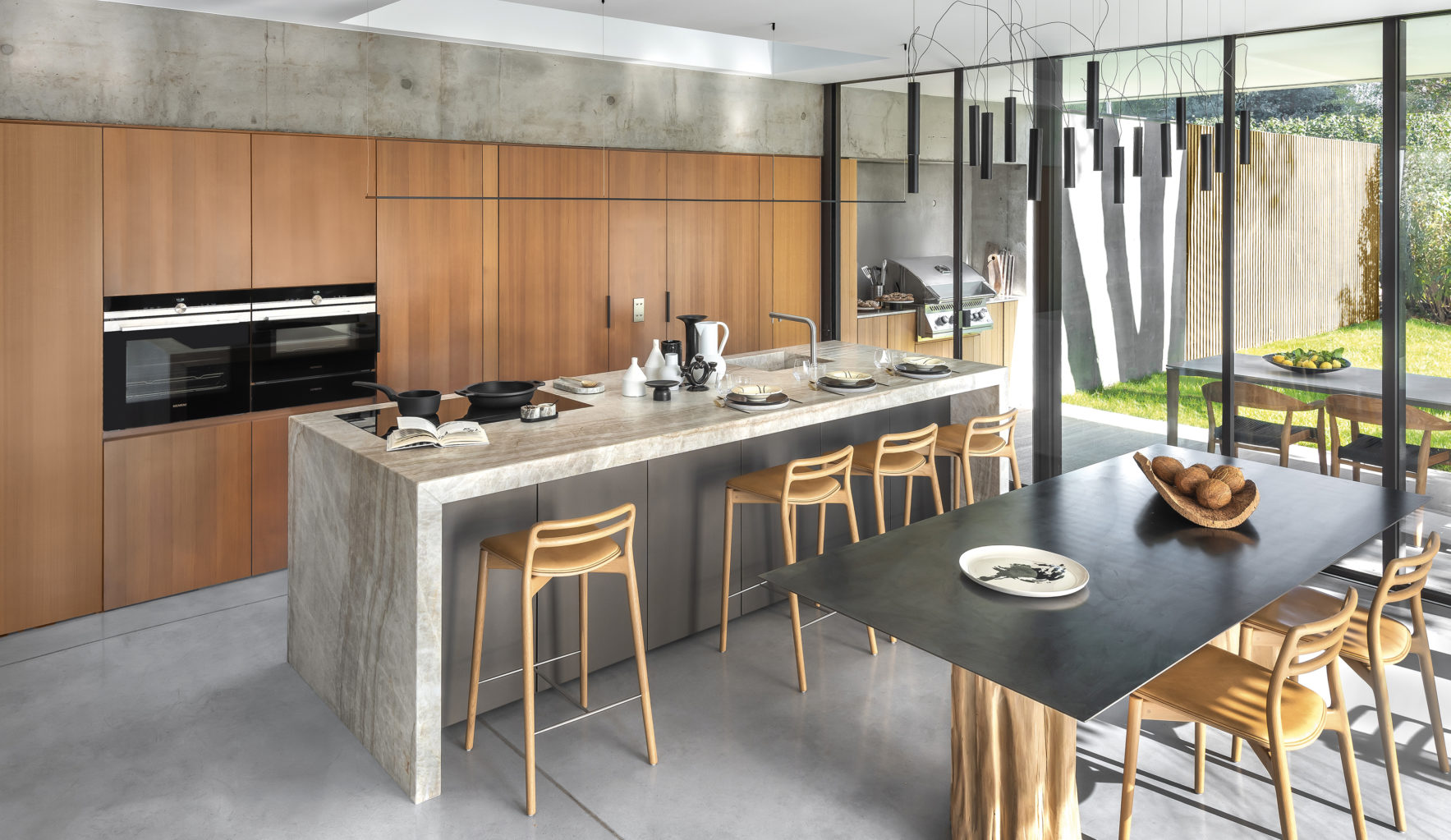 Natural light magnifies a warm, contemporary kitchen.